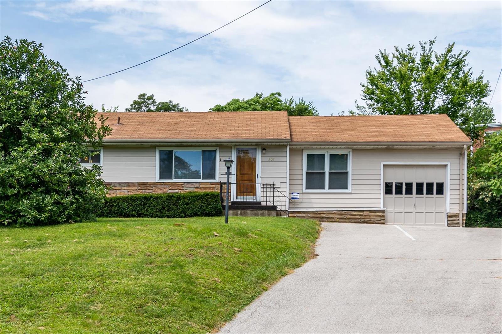 Back on market due to issues with  Buyer's financing, with no fault of seller. 2,000 sf of living space in this rare opportunity for live/work space zoned Residential & Commercial! This ranch home offers 1,154 sf on the main level in the award winning Webster Groves School District. The spacious living room room offers lots of natural light with additional can lighting. Three bedrooms are serviced by the updated full hall bath. French doors adjacent from the living room enter the office or family room. The updated kitchen offers stylish cabinetry with stainless appliances and butcher block counters. Enter the separate dining room/breakfast room with access to the attached one car garage. The lower level features an open finished space with access to the half bath, laundry room and ample storage. The paved backyard has additional parking for 5+ vehicles and a covered patio that is perfect for entertaining. The possibilities are endless! Don't miss this opportunity!