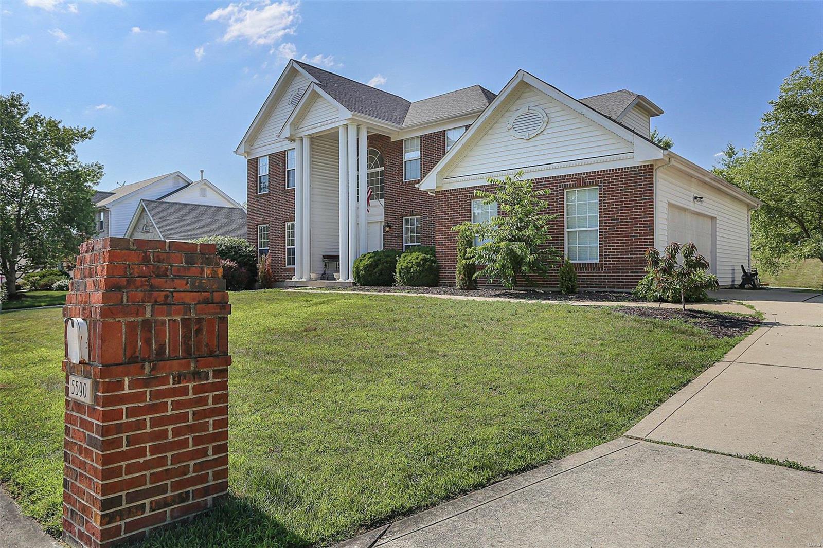 GREAT NEW PRICE !!! This spectacular two story home features an impressive two story foyer with Brazilian Cherry Flooring that extends through out the formal dining room, sitting room/den, main bath, into the impressive great room with a gas fireplace, along with breakfast and kitchen area. This home has neutral interior colors and a crisp white designer kitchen with granite countertops, the centered island has a gourmet stainless gas cooktop, built in microwave above the convection oven in stainless from Bosch and large pantry..  The Master Suite is located on the second floor and has a luxury bath, separate sink/vanity, jetted garden tub and separate shower.  3 additional bedrooms, a full bath.  The lower level includes a recreation room with built in custom shelving, game/tv area and a custom wet bar for plenty of entertainment