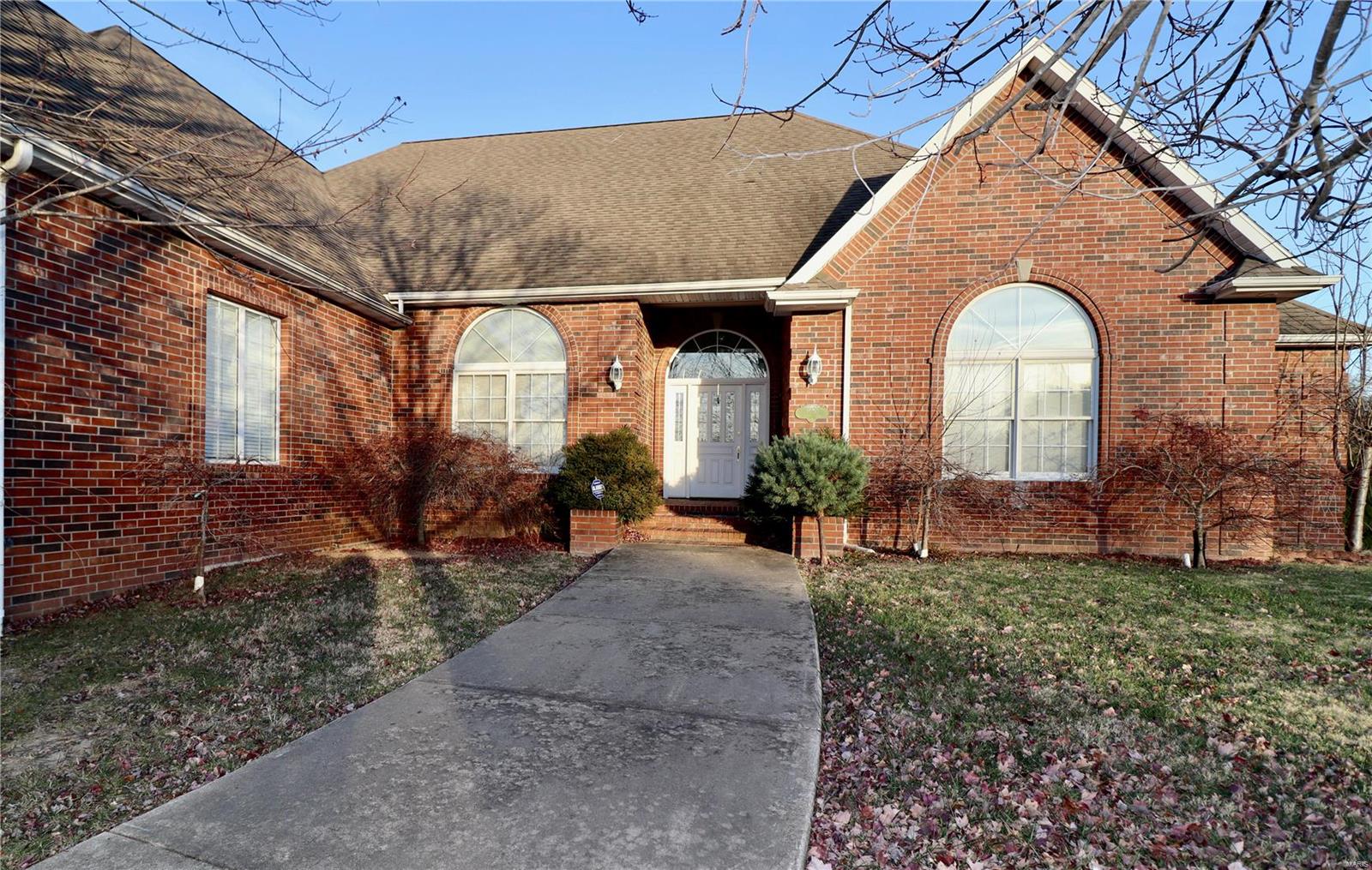You won't find another home with the unique architecture as this one! Come take a look at this all brick home situated on 1.44 acres, and a corner lot, featuring 6,346 square feet of living space, an oversized 3 car garage, 4 bedrooms, 4.5 baths, hardwood & marble flooring, whole house speaker system, central vacuum & so much more. The main level welcomes you in with cove & vaulted ceilings, a stunning formal dining area with custom cabinetry and a wet bar, an office, an impressive master suite and a lovely sun room. The walk-out basement boasts stainless steel appliances, marble flooring in the living area, a safe room, 2 bedrooms and 2 bathrooms, with plumbing for a 3rd bathroom. A John Deere room is easily accessible from your covered patio, leading to your large back yard with multiple gardening areas and fruit trees. New roof installed in March! Call to schedule your showing today! Additional Rooms: Sun Room