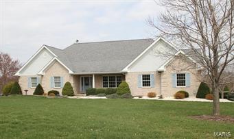 Beautiful country setting yet conveniently located! Immaculate three bedroom, full brick ranch home sits on almost 2 acres and boasts a serene lakeside setting. Gleaming hardwood floors and an abundance of windows greet you upon entry. Enjoy a spacious kitchen featuring large center island, custom cabinets, and breakfast room. Open great room offers a spectacular view and a stone surround gas fireplace. Master suite offers more views from its bay/bow window, walk in closet, and bath with double sinks and separate tub/shower. Open walk out lower level has more lake views with it's wall of windows, an open family and rec room, wetbar, woodstove, two more flex areas, full bath, and second laundry hook up. Walk out to large patio and well manicured lawn. Off the kitchen enjoy a fully brick and screen enclosed porch with access to the side driveway and backyard. Three car side load garage, irrigation system, Pella windows, and alarm system. Close to Missouri Wine Country and the Katy Trail. Additional Rooms: Mud Room