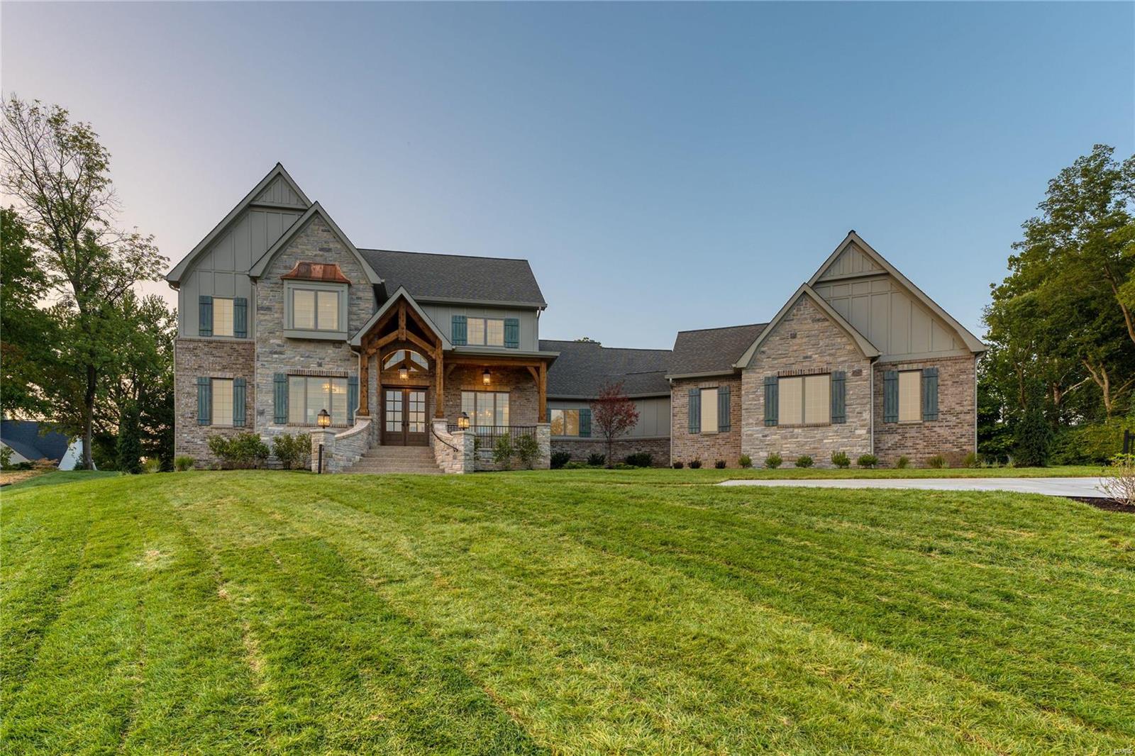 Kemp Signature Homes is proud to present the modified "Huntbridge" plan featuring a captivating front elevation with natural stone and brick masonry, timber beam framed front porch, spacious outdoor room, Mahogany front door and rear entry garage. Beautifully situated on a very private 1.040 acre lot in the middle of the culdesac. Kemp signature Homes boasts many Luxury features such as SMART Home technology, 10' and 12' ceilings on main floor, box beamed ceilings, engineered hardwood flooring,Pella advanced Low-E windows, 4842 s.f. of living space, spacious 20X15 covered veranda, custom crown moulding, and wainscot throughout, Stainless steel appliances and cooktop hood, Kohler fixtures throughout, farm style kitchen sink,Decor SS appliances and much more.3 Bedrooms on 2nd floor plus a large Bonus room (can be a 5th bedroom + bath).  An allowance to customize closets and pantry to buyers wants and needs is included.  Inground irrigation and alarm systems included. Move in ready.