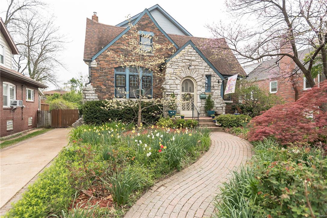 Welcome to the house that love built!!  This magical English Cottage with 2200 sq. ft. + of living space is the perfect home for raising a family.  Spacious Open Living & Dining Rooms allow for great traffic flow when entertaining.    Kitchen Updates include Cabinets, SS Appliances, Countertops, Built-In Bench for family seating, & flooring.  Unique UL Master Suite has 12’ Vaulted ceilings w/ ceiling fans, spacious master bath with 2x Size Jacuzzi Tub & Double Bowl Vanity.  Two separate rooms annex the Master Suite and have endless options for use.  Perhaps a nursery for one & an office or cool Closet Organizer in the other?   The Trellis enclosed back porch is a private sanctuary for your hearts delights in addition to an enclosed play space for children on rainy days.  Walkout LL has partially finished family area & a ½ bath & work room for the handy man/woman.  Enjoy the prepared garden to grow your own vegetables.  Also included is a swing set frame for summer fun!