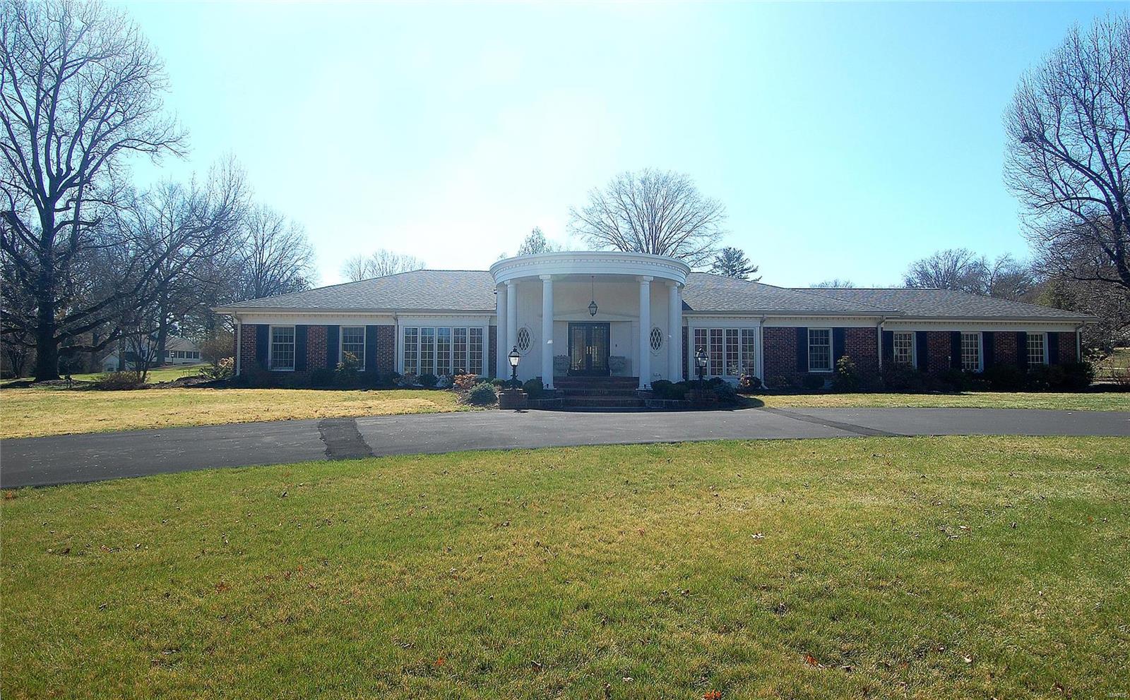 With a classic architectural design, this sophisticated & smartly updated ranch sits on acre+ lot in upscale neighborhood across from Bellerive CC in Town & Country. Light & bright, a formal entry opens to living rm, dining rm & family rm. Walls of windows, tall ceilings, hardwood flooring, & exceptional moldings provide an inviting & upscale tone. Award-winning Brooksberry kitchen w custom cabinets, Wolf cooktop, double ovens, integrated SubZero refrigerator, granite & Caesarstone counters, center island w seating & utility sink, walk-in pantry & butler’s pantry. French doors in breakfast rm open to mudroom, ‘office’ & access to finished LL. Airy family rm wall of windows stages beautiful backyard setting! Spacious master w updated bath, 2 addl bdrms share updated full bath. Circle drive, inground irrigation, security system, new roof (3/2024), 3 car garage. A real GEM convenient to medical facilities, upscale schools & shopping, & major highways.