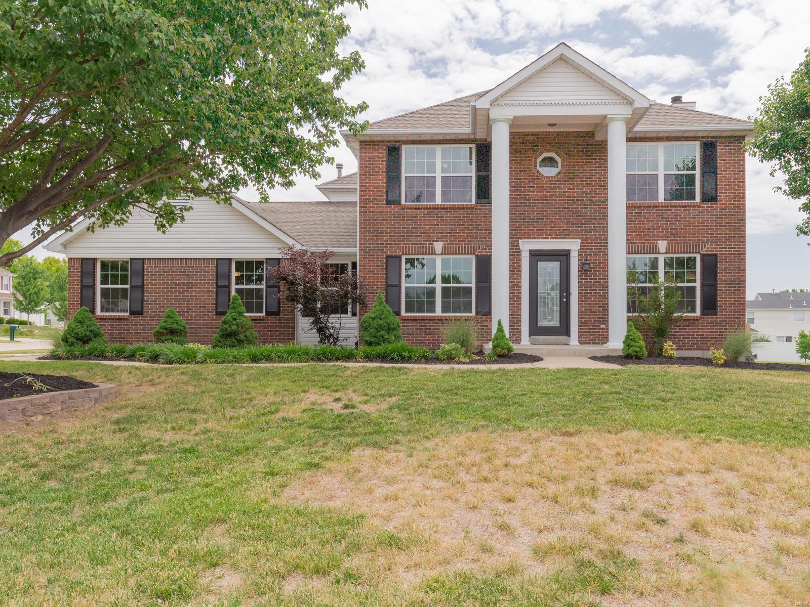 So many wonderful renovations you have to step inside! Gorgeous 2-Story w/Finished Lower Level (Approx 2600 sqft living space) with 4+Bdrms & 3.5 Updated Baths. Elegant Brick Front with Columns, New Front door with leaded glass, Vinyl Wood Plank Flooring, Awesome Kitchen w/42" White Shaker Cabinets, Granite Counters with extended island for seating, Subway tile, Stainless Steel Appliances, Open to Family Rm with Stacked Stone Fireplace, French Door to Patio and Fenced Yard, Main Floor Laundry, Retreat upstairs to Master Suite with Coffered Ceiling, Walk-in Closet, Dbl Vanity, Sep Tub & Shower, three additional Bedrooms & updated bath complete upper level...Need add'l space, retreat to Finished Lower Level w/Large Rec Room, Office/Guest Rm and Full Bath.  Oversize Garage, New Windows, New HVAC system, Upgraded Lighting, Wonderfully Landscaped, Fenced Yard...Located close to shopping, restaurants, schools & parks. Highly Rated Ft Zumwalt Schools. Be ready to call this one YOUR NEW HOME!