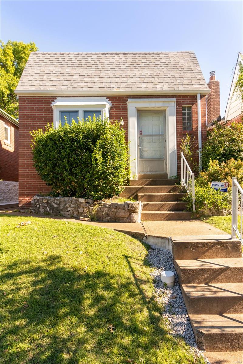 Great opportunity with this clean, all brick home. One car garage.  The spacious living room offers lots of natural light through the large front window and several glass block windows. There is a decorative fireplace area, set up for an electric insert, and hardwood floors are under the living room carpet. The bedroom also has hardwood and a spacious closet.  The kitchen has vintage, metal cabinets that are in great shape, and a pantry in the dining room.  You also have access to the 3-season room from the dining area.  The basement is a walk out and has decent ceiling height if you choose to finish it for an extra bedroom. The backyard is completely fenced and is very private.  Home is to be sold AS IS.  Seller to do no inspections or repairs. Additional Rooms: Sun Room
