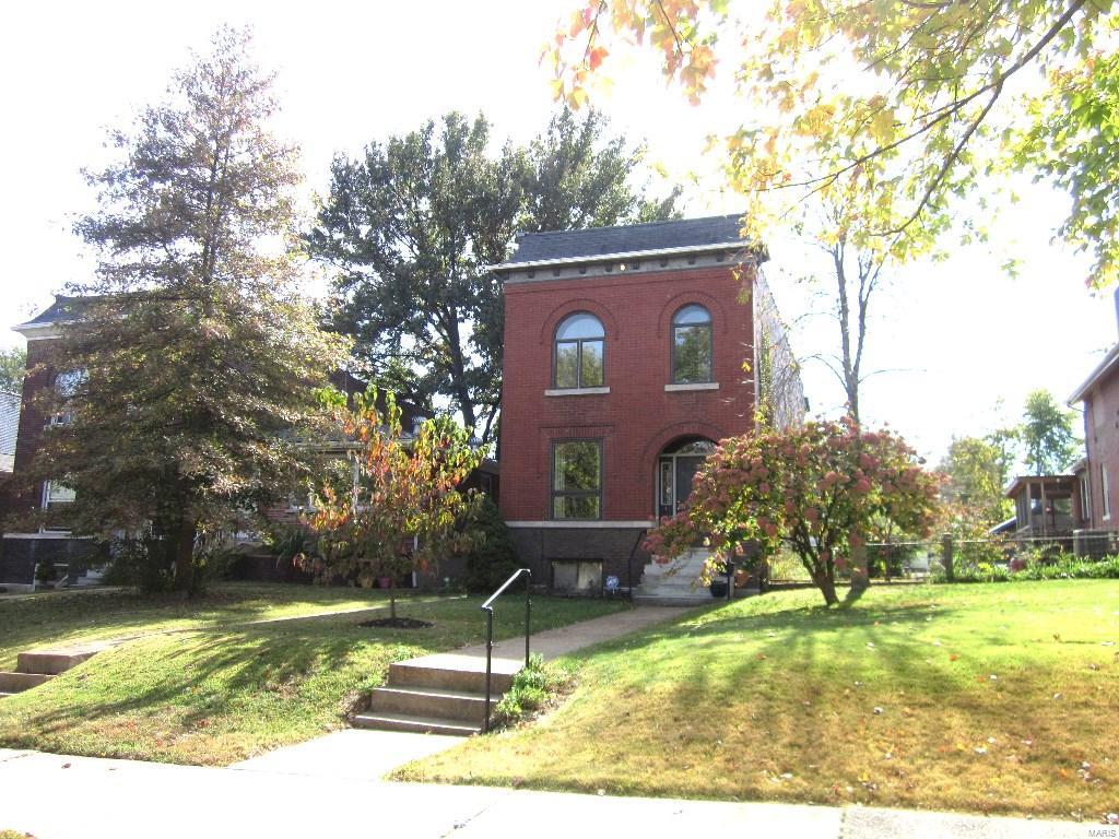 What a St. Louis Beauty!! You will love the location on this leafy park-like boulevard -  with great walk-ability to all the food and fun on The Hill! Inside this lovely brick manse are well-proportioned rooms and a flowing, flexible, and open floor plan. LR and DR boast 9 foot ceilings, patterned hardwood floors. One of the two nicely updated full baths is also located on the first floor. Next comes the dynamite kitchen with a center island, stainless steel appliances, custom cabinets, solid surface counters, a butler's pantry and a large walk-in pantry. Gravitate from here out onto the covered porch overlooking a great yard and 2 (!) car garage. There is more to love upstairs in three spacious rooms and second full bath (currently used as 2 bedrooms and office/family room), 3 skylights, a steam sauna (!), and a second, private, covered porch. Peace!!