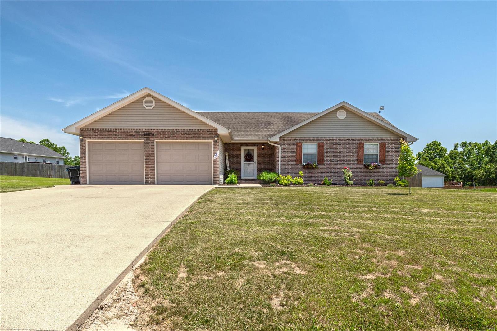 You dont want to miss this great 3 bedroom home sitting in the Northern Heights Subdivision on a flat lot with a fenced in back yard! Upon entry of this home you will notice a nice covered front porch, and  beautiful landscaping in the flower gardens.  The inside of the home features a spacious open floor plan with the living room having lots of natural light and laminate wood flooring that extends into the dining room area as well.  The kitchen is good sized having custom oak cabinetry,  ceramic tile flooring, tile back splash and black appliances. All the bedrooms have carpeting and the master bedroom is very spacious with a walk in closet, bump out window, and a full bathroom with a double vanity, ceramic tile floors and a jetted tub/shower combo. The two guest bedrooms are  of good size with nice sized closets.  There is a guest bathroom that has ceramic tile floors and tub/shower combo.  The garage is very good sized and has a pull down ladder to access attic storage too!