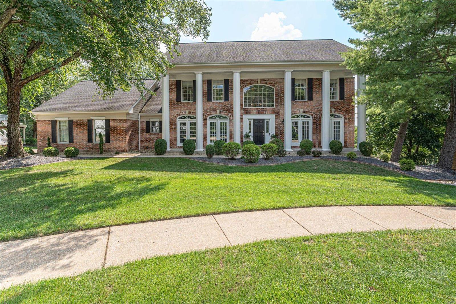 Welcome to this impeccably maintained 2-story home in sought-after Wildhorse Village neighborhood! With 5 beds and 4.5 baths, this home blends elegance, comfort, and convenience. The main floor features a spacious den/office, formal dining room, and a bright great room with a cozy gas fireplace. The large eat-in kitchen boasts a center island, abundant cabinetry, and ample counter space with connected living room that walks out to the deck, perfect for seamless indoor-outdoor living, and main floor laundry adding convenience. Upstairs, boasts the vaulted primary suite, offering dual closets and beautiful bathroom, and three additional well-proportioned bedrooms. The entertainer’s dream lower level includes a kitchenette, media area, rec space, home gym, bedroom, and full bath. Large windows provide a bright, open feel which walks out to a stone patio and covered putting green. A private wooded backdrop completes this stunning property. Close to everything Chesterfield has to offer.