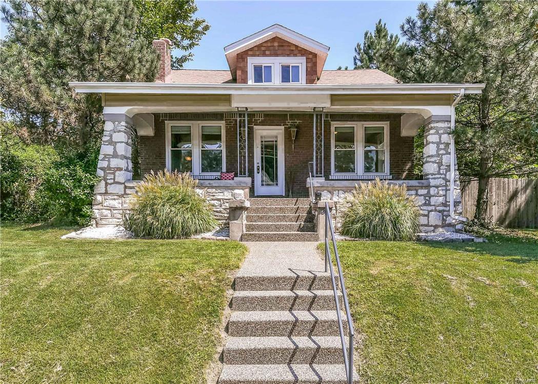 Stunning interior renovation meets breathtaking outdoor living space in this one-of-a-kind home on 0.37 acres in award winning Dogtown Neighborhood.  The spacious Custom Kitchen & Rear Dining Room feature picture windows that highlight the Koi Pond, Natural Rock Landscaping & Custom Patio in the vast outdoor living space.  Incredible Large Master Suite offers double closets, reading nook, & Master Bath has Adult Height Double Vanity, Cherry Cabinetry, Jacuzzi Tub & Separate Shower.  The Living Room features Hardwood Floors & Historic Millwork, Crown Molding & Decorative Columns. Stained Glass Windows flank the Living room fireplace that has Gas Logs & a Marble Hearth.  NEW Windows throughout provide a bright & airy feel.  Newer A/C, Electric & Plumbing! Centrally located to Universities, Hospitals & Clayton, within walking distance to Restaurant's, Shopping, & Forest Park.  The 63139 zip-code was voted #1 Hottest Zip Code in St. Louis this Summer.  Don't miss this one!