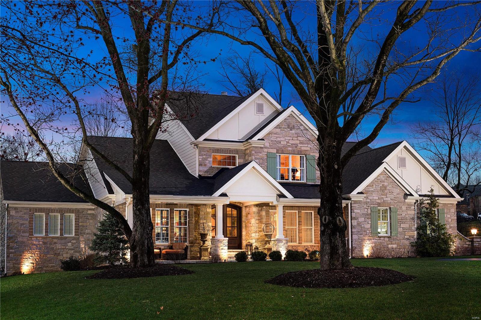 Spectacular stone home with gorgeous front porch & two-story entry foyer by Jeffery Homes. Amazing hardwood floors & millwork throughout. Elegant formal dining rm w/hand painted wallpaper, living rm w/gas fireplace & custom mirrored wall, den w/ tray ceiling & built-in bookcases.Gourmet kitchen w/ a center island, custom cabinets, high-end appliances plus butler's pantry w/ wet bar & wine chiller. Casual dining area & hearth rm w/ vaulted beamed ceiling & stone fireplace adjoin the kitchen. First floor master suite features his/hers closets & a luxurious bath w/ walk-in shower, soaking tub & double vanities w/ an abundance of storage. Upstairs includes three additional bedrooms & loft. Very special open lower level features a large wet bar w/ custom cabinets & 2 beverage coolers, dining area, family rm w/ wainscoting, built-in bookcases & bunk beds. Play or craft area that adjoins exercise room.3 car garage,custom deck & wonderful flagstone patio complete this very remarkable home! Additional Rooms: Mud Room