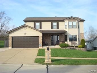 Welcome Home! This well maintained, original owner, 2 story, 4 bedroom, 2.5 bath, 5 car garage is ready for new owners! Step onto the large covered front porch & enter into the foyer w/hardwood flooring leading to the kitchen that offers 36 inch cabinets w/crown molding, 2 pantry's & stainless steel appliances (that stay)! Breakfast room w/bay window & family room w/hardwood floor & WB fireplace. Sliding glass door leads to the patio & 3 car detached over sized garage & a place to store boat or trailer & there is still plenty of yard. You will find a formal Living room w/bay window & Dining room & the 1/2 bath to complete the first floor. Upstairs you'll find 4 large bedrooms & 2 full baths. Master bedroom has a bay window, master bath offers separate tub & shower & walk in closet. There are plenty of closets in this home! The yard is fenced & backs to trees. All stainless steel appliances stay & the washer & dryer! New roof in 2017 on home & garage! Home Warranty! Fox C-6 Schools!