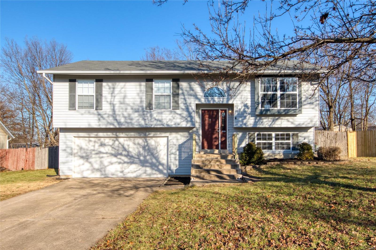 Welcome home to this remarkable split-foyer ranch nestled in the quiet suburb of Windsong and within minutes of local shops and eateries!! You are greeted by the open, vaulted foyer. On the main level, you'll find a spacious, carpeted living room with a huge window to let in that gorgeous sunlight! The kitchen boasts stainless steel appliances, dark wood cabinetry, and built-in microwave! Plus an attached breakfast room with a walk-out on to the spacious deck! The master bedroom suite features a full bath, plush carpeting, and a ceiling fan! Two more carpeted bedrooms and a second full bath round out the main level! Head downstairs to find a generously sized family room with built-in shelving and walk-out to the patio and backyard! Lower level also features a 4th bedroom! Fully fenced, the roomy backyard is a great spot to enjoy a nighttime bonfire at the lovely firepit! Home boasts a new roof installed in October 2019! Don't let this one slip by! Schedule your private showing today!