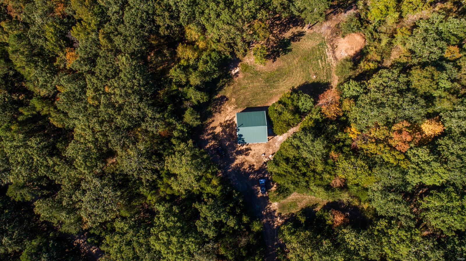Enjoy the private setting of this mostly wooded 155+/- acre tract located in Silva, MO, Wayne County that is sure to entice the most avid of hunters. The current owners have put much effort into making this a turn-key hunting property for you to enjoy from the get-go. A well-preserved trail system has been developed, allowing you to navigate through the property with ease. During your travels, you will find 4 watering holes and 3 established food plots to help draw in the wildlife. For a more effective hunt, take your pick of one of the 13 deer stands situated throughout the property. TSI practices have been performed to help enhance the quality and efficiency of the property, including a controlled burn that was completed 2 years ago.  Relax in the uniquely built cabin constructed in 2015 that comes equipped with 3 BR, living area, and a small kitchen area. Electric heat and air are available as well as a wood stove. A cell tower is located nearby allowing sufficient cell service.