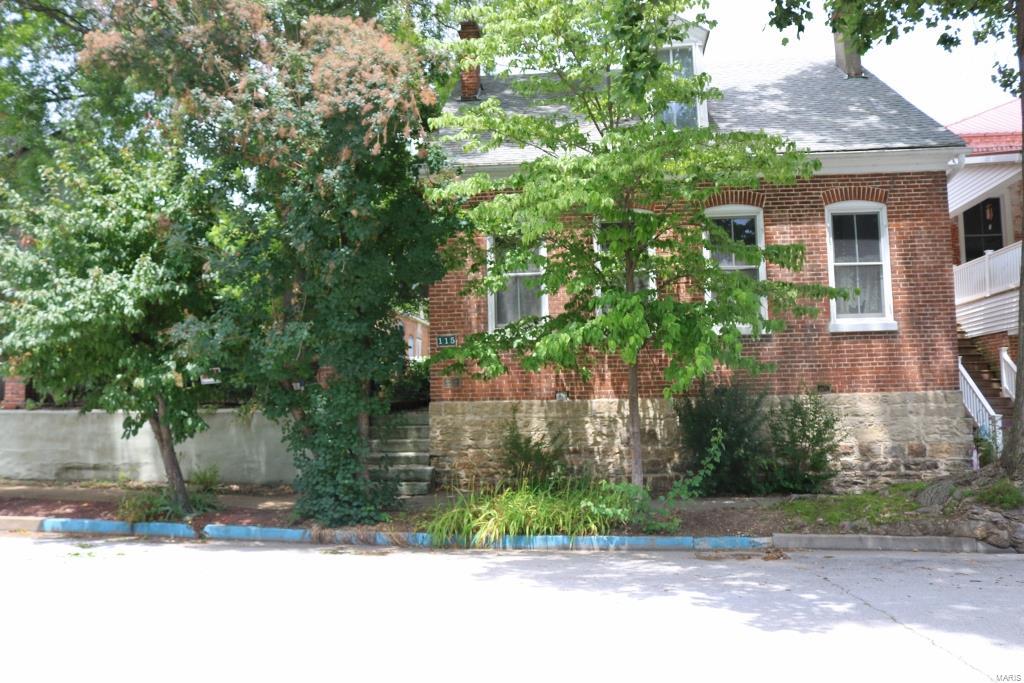 HISTORIC HOUSE IN HERMANN!!  3 bedroom, 2 1/2 bath all brick historic home located in the Heart of Hermann.  Convenient location within walking distance to shops, restaurants, coffee shop and train station.  Historic home features a cute little back courtyard and small side yard all enclosed in an iron fence.  Inside the home offers a large living room, eat-in kitchen and separate formal dining room.  There is also a family room/parlor area with double doors leading out to the backyard, main level laundry and main level master bedroom with a half bath.  The upstairs features two large bedrooms and a large upstairs bathroom featuring a antique claw foot tub.