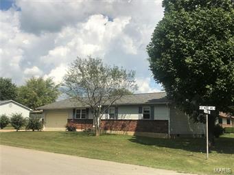 EASY LIVING ON ONE LEVEL Nice corner lot with large shade trees behind Veteran's Home, 3BR well cared for ranch home with aluminum siding, roof about 3 years old, an asphalt & concrete driveway, central HVAC, thermal tilt-in windows and carpeting that's about 4 years old.  Master bedroom has its own half bath and whole wall of closets.  Kitchen has nice appliances and great work space with a breakfast bar for morning coffee and kids' sandwiches.   The 2-yr old water softener is a real plus and is included, and there's plenty of storage with pull down stairs to attic in garage, which has an opener.  Great family bbq's can be enjoyed on the 20'x10' covered patio out back.  This one's ready for a new owner, so come see and be in for the holidays!
