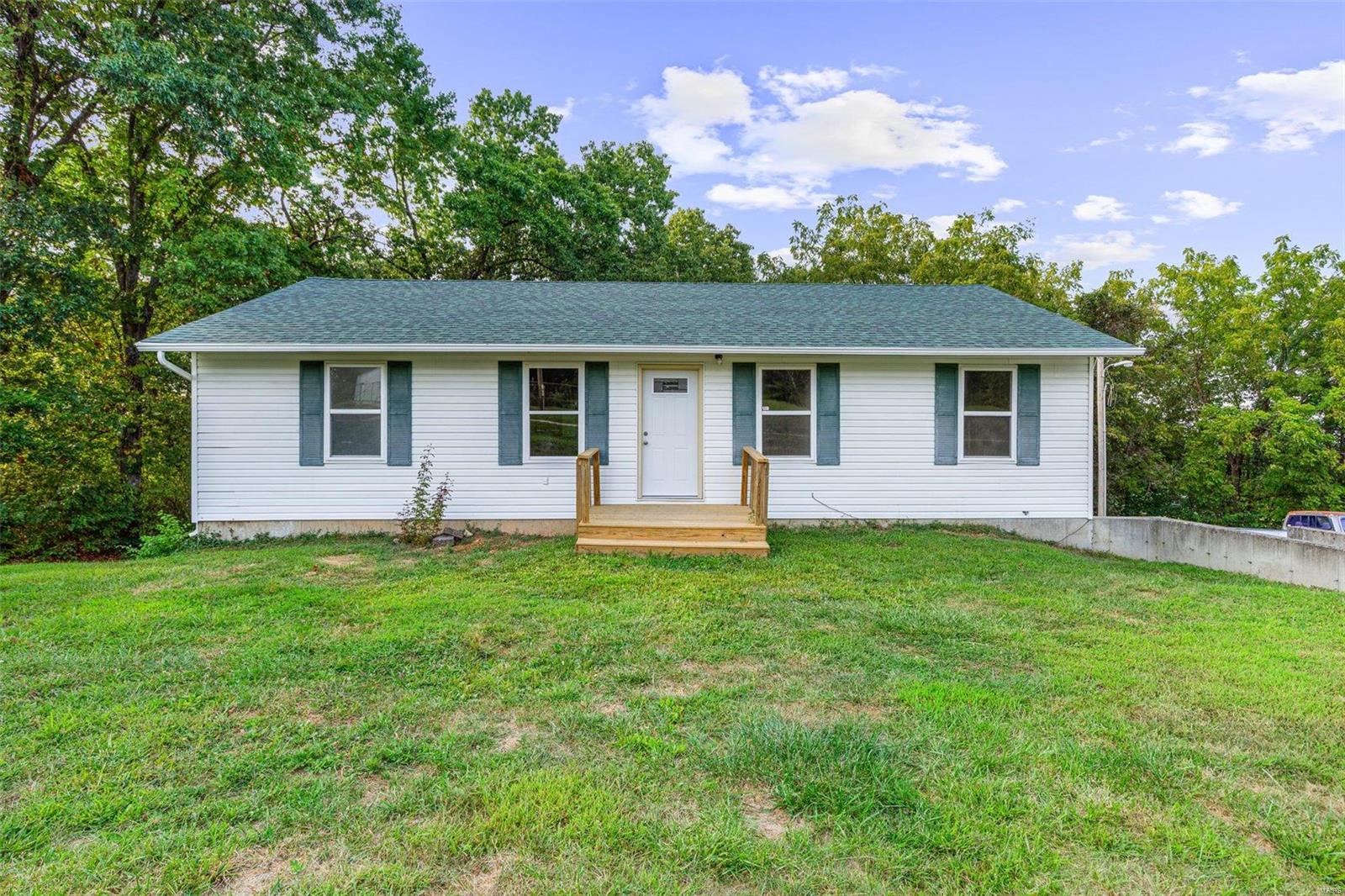 Nice Ranch home on .73 acres per tax record.  4 car garage parking - 2 in the attached garage, and 2 in the oversized detached garage with mandoor, shop, and new garage door on detached with openers. A/C unit one month old, roof 2023. Finished walkout basement with full bath, 3 bedrooms, 3 full baths, wet bar/kitchenette in lower level, deck, cathedral ceiling in Living Room, and main floor Laundry. Home built with 2x6 walls.  Bloomsdale Elementary, Ste. Genevieve Middle and High School. Close access to I-55.