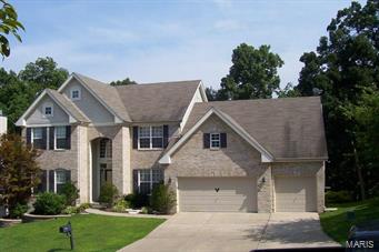 Welcome to this stunning & spacious 1.5 sty with brick/stone front & 3 c garage. Pride of ownership shows throughout. Starting with the 2 sty front entry, formal dining to the right, proceeding to the impressive 2 story great rm w/built-in entertainment shelves & gorgeous windowed back wall facing the private wooded setting. The kitchen features stainless steel appliances, breakfast bar, ctr island & breakfast rm w/inverted vaulted ceiling & walk out to huge double deck. As a plus there is a cozy hearth rm w/fireplace & hardwood floors. MN fl master BR suite has double door entry w/overhead transom, bay window, luxury bath w/double bowl vanity, marble shower w/glass surround ,corner tub & huge walk in closet. The loft has many uses & overlooks the beautiful great room. Jack & Jill bath connects the 2 spare bedrooms which is perfect for the upstairs occupants. Unfinished LL has back windowed wall & walk out to lower deck, also a partially finished bath just waiting for final touches.