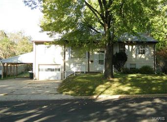 This 4 bedroom, 2.5 bath home sits on a full finished basement, has a 1 car garage, a covered carport and sits on a 0.22 m/l acre lot.  The kitchen is equipped with an electric range/oven, dishwasher, disposal & refrigerator.  The basement has a bedroom, bathroom, family room and laundry room.  The home is cooled with central air and has propane heat.