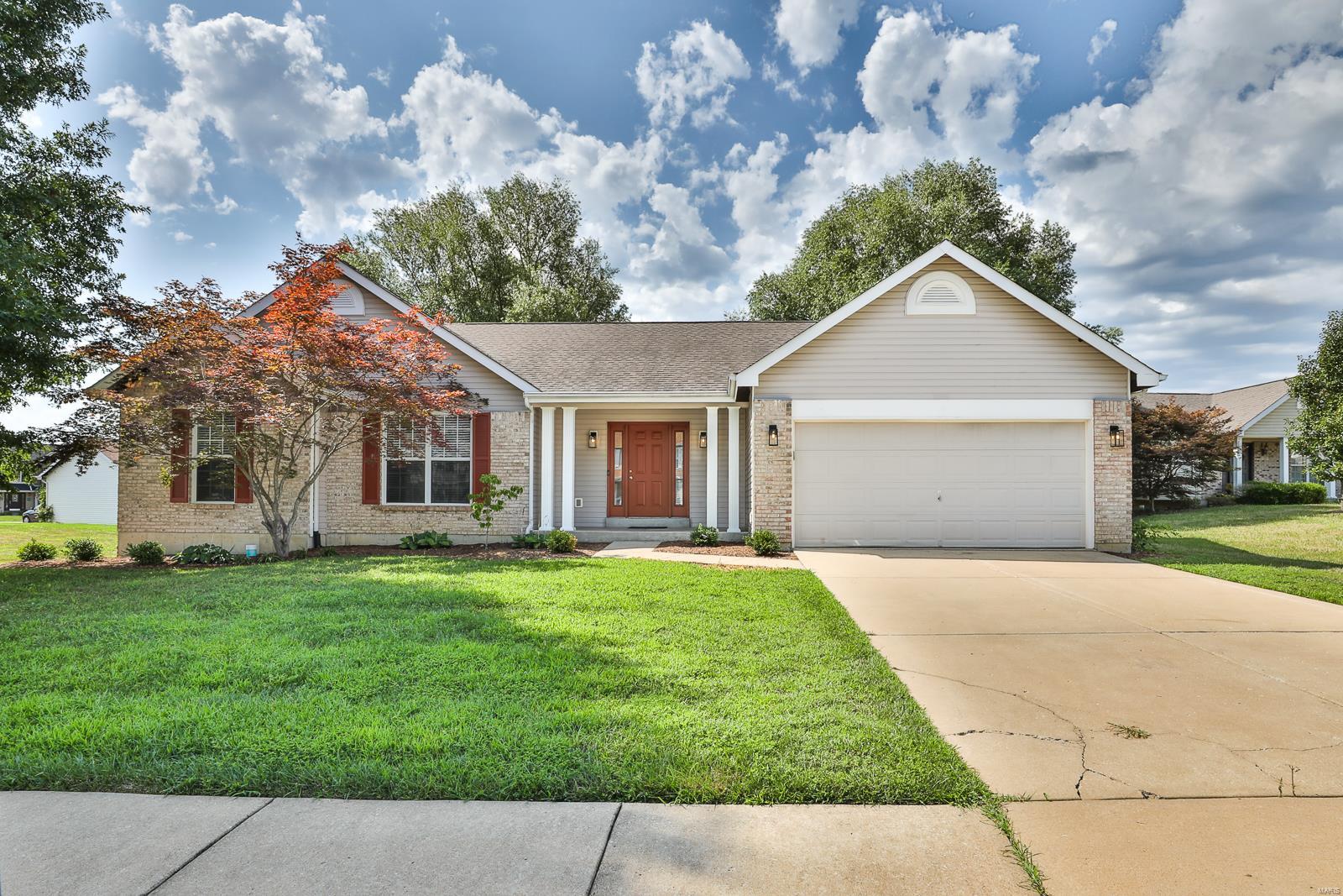 FULLY Updated Ranch in Wentzville!  Vaulted great rm boasts refinished hardwood floors & Gas fireplace w/raised hearth & brick surround. Floor to ceiling Kitchen upgrades include lighting, crisp white cabinets w/trendy black hardware, gleaming quartz counters, center island w/breakfast bar, SS appliances & sink PLUS flooring! Sliding glass door opens to lovely vaulted 3-season rm- ready for cozy fall evenings. Refinished hardwoods highlight the master suite, complete w/walk-in closet & private bath features New double sink vanity w/Carrara Marble illuminated by upgraded lighting, shower w/upgraded showerhead & a sleek new stand alone tub. Nicely sized beds 2&3 offer fresh carpet & lighting. Full hall bath also has upgraded fixtures & flooring plus Carara marble vanity!  Main Flr Laundry w/new flooring. Fresh paint & new 2-inch blinds can be seen throughout the home!  Basement has rough-ins and whole house is wired for a generator.  NEW 14x20 concrete patio, fresh landscaping & paint!