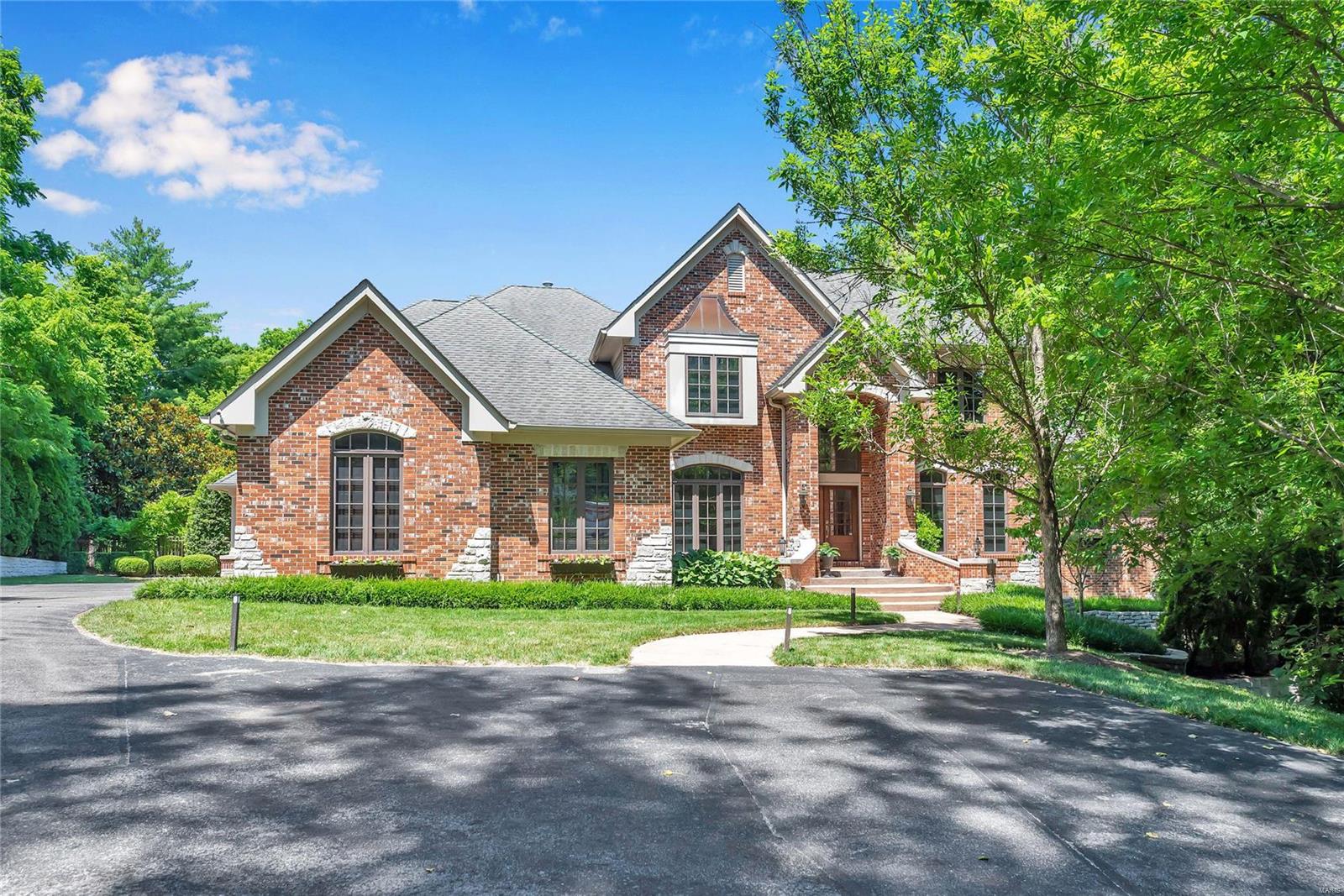 This is the turn key Ladue Estate you have been waiting for w/ over 6000 sf of updated living space, finished basement w/ bar, theater & sauna & outdoor oasis w/ large inground pool, outdoor kitchen, built-in hot tub & outdoor fireplace! Walk into the expansive 2 story entry foyer into the sunlit living room w/ custom chandelier, newer built in bookcases & stone fireplace. Be wowed by the chefs kitchen w/ white custom cabinetry, sub zero refrigerator, thermador gas range, quartz ctops, walk in pantry & butlers pantry. The open breakfast room & hearth room opens to a screened in porch overlooking the private tree lined backyard. The master suite w/ his & her closets & bathroom w/ double sinks, walk in shower & large soaking tub completes the main level. Upstairs features a newly updated family room w/ built in entertainment center & shelving & 3 additional suited bedrooms. The LL will impress w/ movie theater, bar, walk in wine cellar, sauna/steam room, rec area & 5th suited bedroom. Additional Rooms: Mud Room, Wine Cellar