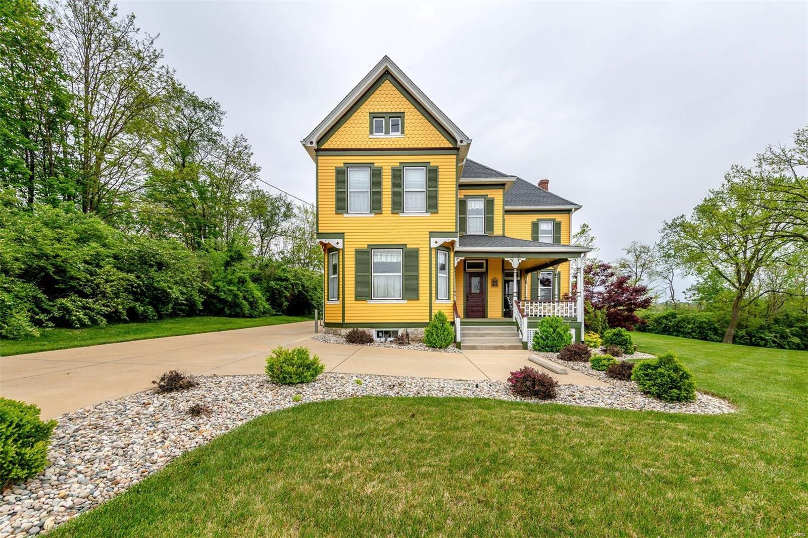 Stupendous historic 2 Story home, 3 bd, 2 ba, level lot, tons of parking in the highly desired area of Manchester, the most attractive living & shopping destination in West County. Entry foyer brings you to the living room where you are drawn to the lovely windows that allow tons of natural sun to flow, a large family room for bonding & entertaining. Gorgeous original pine floors, refinished throughout. Eat-in style kitchen has stylish white cabinetry for all your culinary supplies, attractive lighting & lovely backsplash. The stunning bathroom on the main level has a stunning tiled rain shower w/glass door & vanity. Sleep in tranquility in 3 bds located on UL & large full ba features ceramic tile floor. The laundry area has stackable w/d for convenience. LL has plenty of space for storage & organizing. Inviting covered front wrap porch is perfect for sipping morning/afternoon tea, also a covered rear porch to soak up the sunshine, an oversized parking area & outside storage building.