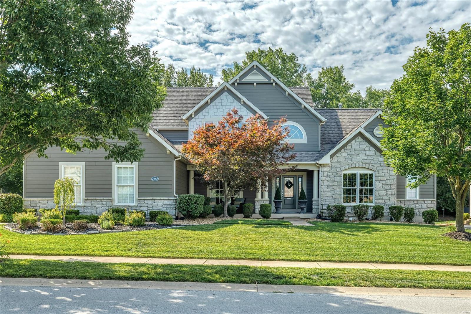 This spectacular Fischer Fritchel crafted 1.5 Sty features distinctive design elements throughout including soaring ceilings, detailed trim work & birch hardwoods that extend throughout the main living area. Impressive 2-sty foyer leads to private study, formal dining room & stunning great room with marble fireplace & dramatic 2-sty bow window. Chef’s kitchen with 42” maple cabinetry, granite countertops, Jenn-air appliances & exceptionally large island adjoins breakfast room with atrium door to patio & hearth room highlighted by floor to ceiling stone fireplace. Main floor primary bedroom suite with coffered ceiling & luxury bath with jetted tub offers an appealing retreat. The 2nd floor extends the living quarters with 3 additional bedrooms, 1 with ensuite bath & 2 with Jack n’ Jill bath. Lower Level includes media room, perfect for casual entertaining 5th bedroom, bonus room & full bath. Situated on a premium lot in a prestigious gated community walking distance to Wapelhorst Park.