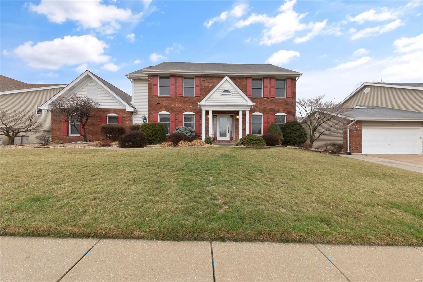 Welcome to this stately home on a quiet street with a gorgeous brick elevation and a large rear-entry garage! This property is loaded with upgrades inside and out. You'll love the wood flooring in the foyer which is flanked by spacious living and dining rooms. The great room is welcoming with a full masonry woodburning fireplace and beautiful millwork and crown molding. The kitchen is a chef's delight and has been upgraded with granite counters and has TONS of cabinet and counter space as well as a walk-in pantry. You'll love the cozy breakfast room which opens up to a massive screened porch and nicely landscaped back yard. This layout is perfect for entertaining! Upstairs you'll fall in love with the massive master suite which boasts his & hers walk-in closets and an upgraded full bath complete with custom cabinetry, quartz counters, a soaking tub and separate shower.  Down the hall you'll find another full bath and 3 generously sized bedrooms. This impressive home will not last!