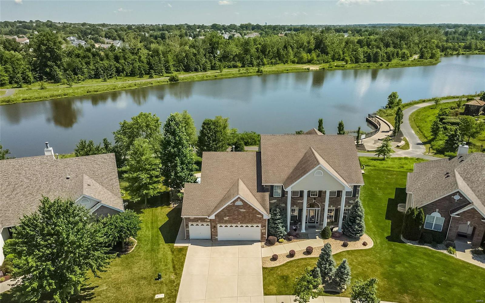 Vacation at Home, EVERYDAY!! Enjoy Lakeside Elegance in this 5bed, 4th Colonial 1.5 Sty w/ your own private in-ground pool, landscaped gardens & the best lake views in the area! Don’t wait a year to build a pool, this one is ready today! Grand covered porch, gracious 2-sty foyer, formal liv & din rooms, soaring ceilings, private office & all of the upgrades one would expect in this gem built by Vantage Homes. Cherish a quiet cup of tea on the huge screened in deck overlooking the water & walking path. Gather around the 9-ft kit island, or in the light-filled breakfast room and adjoining great rm w/ gas FP.   Spacious main flr master suite w/ huge walk in closet, double vanity, luxury bath & sep shower offers a relaxing retreat.  Bonus loft, 3 additional bedrooms & full bath complete 2nd floor living quarters.  LL offers a full guest apartment w/ 2nd kitchen, liv area w/ FP and a workout room plus lots of great storage. Too many more wonderful options to mention. Book an appt today! Additional Rooms: Sun Room