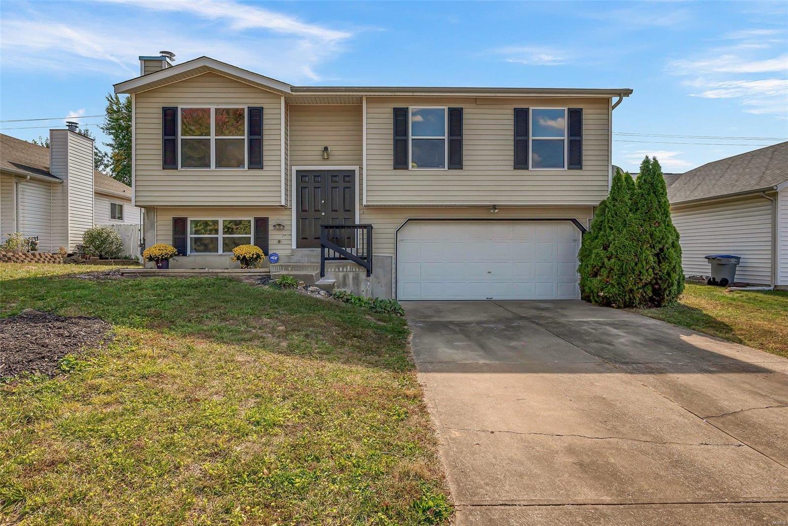 This updated split level home is MOVE IN READY! Bright and cheery Vaulted Family Room is open to the kitchen area with solid oak cabinets and separate dining area. White appliances and Refrigerator to stay. Master Suite with walk in shower plus 2 more spacious bedrooms on the main level. New stain resistant carpeting and luxury vinyl plank flooring. Fresh neutral paint throughout w/ newly installed 6 panel doors, window screens, thermostat, and front porch rails. Lower level has living room with woodburning fireplace and utility/ laundry room. Spacious 2 car garage with plenty of storage space and large driveway. Brand new wood deck leads to a level backyard that is fully fenced. New Roof and Chimney Cap in 2022, HVAC and Water Heater 2012. Home is located on a quiet cul-de-sac and is close to shopping and dining.