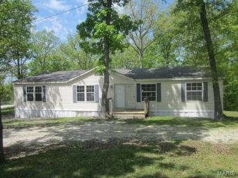 ARE YOU LOOKING FOR THAT RURAL FEELING OR MAYBE JUST A PLACE TO GO TO GET OUT OF THE CITY?  THIS IS A MANUFACTURED HOME THAT SITS ON 3.26 ACRES OUT IN ROBERTSVILLE, MO .  THIS HOME HAS LOTS OF SPACE IS SURROUNDED BY WOODS. IT FEATURES A MASTER BEDROOM SUITE, VAULTED CEILING IN KITCHEN AND LIVING ROOM.  BUILT BOOK SHELVES IN THE LIVING ROOM AND A DECK OFF THE BACK.  JUST THINK ABOUT HOW RELAXING THIS WOULD BE!  Please refer to HUDHomestore for the most recent bidding Period details and information on this property.  HUD Acquired Property. Property being sold 'AS IS'. All utilities are turned OFF. Please, use discretion when showing and bring a flashlight. Bidding open to owner occupants only through 06/09/115 and open to all bidders on 06/10/15. SpecialListingConditions: Foreclosure