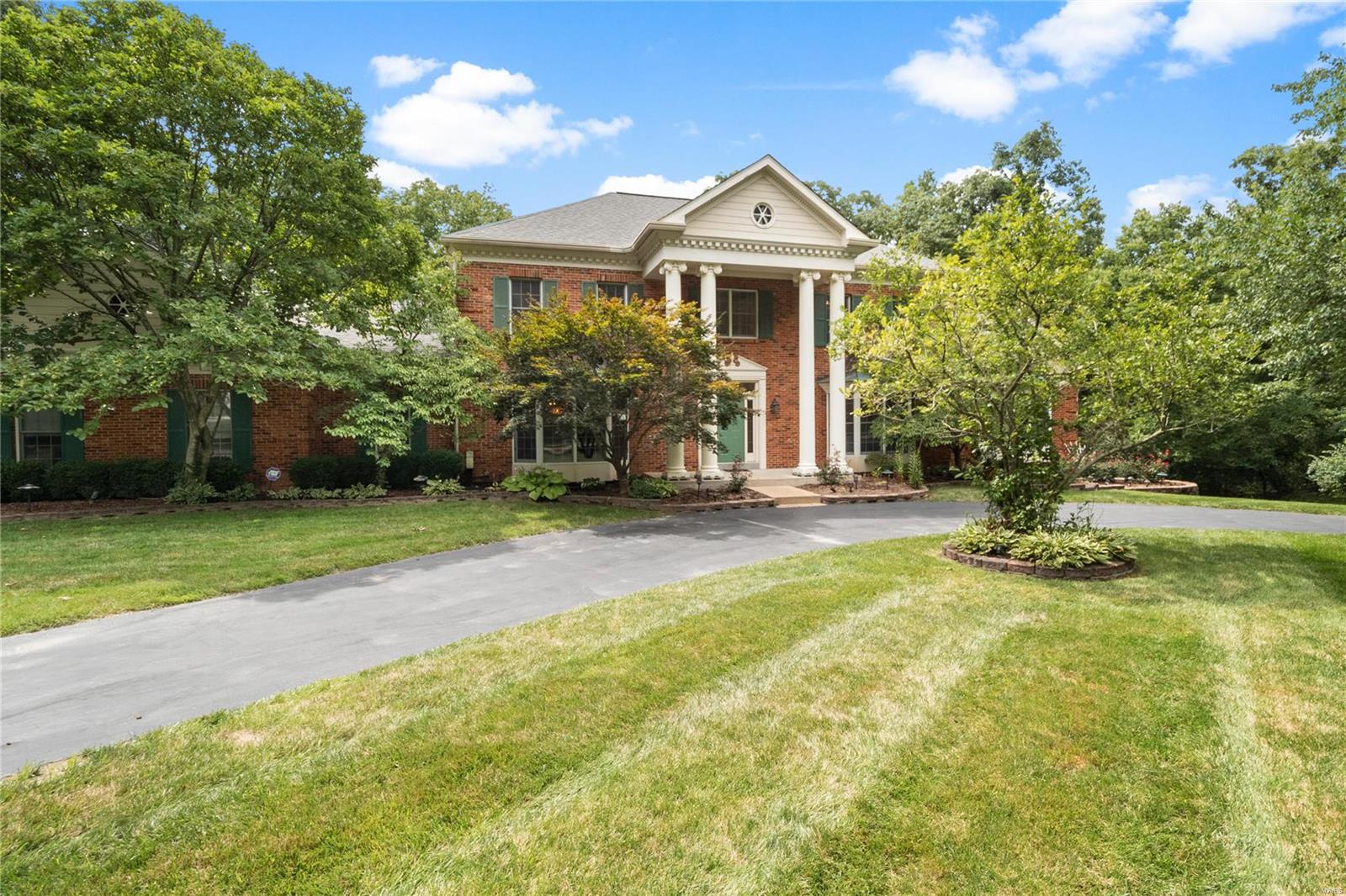 Remarkable 1.5 story home located on a gorgeous lot, perfect for a pool! Enter the grand 2 story foyer to find gleaming hardwood floors throughout most of the ML & UL. The dining rm & den flank the entry foyer. The beautiful great rm features a full masonry fireplace, boxed/beamed ceiling, built-in bookcases, walk-behind wet bar & French doors to the sunrm. The gourmet kitchen boasts granite countertops, double ovens, a gas cooktop & an adjoining breakfast rm with a planning desk & access to the expanded deck. Your own private retreat awaits you in the master suite with a sitting rm, a large bedrm with 2 walk-in closets & a full bath with double vanities, a whirlpool tub & walk-in shower. 4 addtl bedrms & 2 full baths on the UL. The finished walk-out LL is perfect for multi-generational occupants with a large rec rm with a walk-behind wet bar & full kitchen, media rm, bedrm, full bath & a 2nd sunrm. Addtl features include ML laundry rm, patio, deck, 3 car finished garage & much more! Additional Rooms: Sun Room
