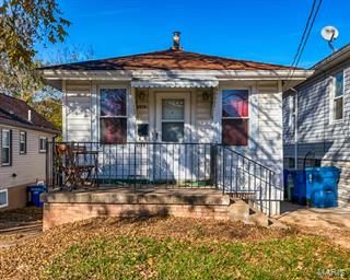 DRASTIC PRICE REDUCTION! MOTIVATED SELLER! A Perfect Bungalow! This charming 2 bedroom, 1 bath home is nestled in the heart of Affton & is PRICED TO SELL! The welcoming front porch is a perfect place to enjoy your morning coffee. Walk-in the front door and find this cozy living room boasting gorgeous refinished hardwood floors & 5” baseboard. Plenty of natural light can be found through newer vinyl & stunning stain glass windows. The living room opens into the dining room with neutral paint & a unique chandelier adding a pop of color.  The spacious kitchen features newer striking ceramic flooring, new modern light fixture, plenty of cabinetry, & garden window. The 2nd bedroom could also be used for the perfect office or craft room. Don’t forget about the partially finished walk-out lower level, NEWer SEWER LATERAL system 2014, large level fenced backyard & MORE! Property is being sold in as-is condition. Seller is to do no repairs, replacements, inspections & to offer no warranties.