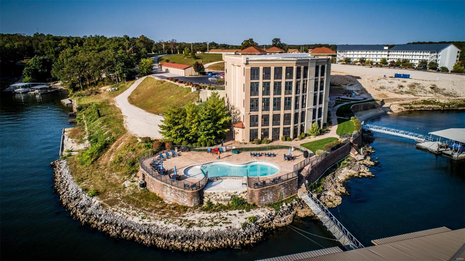 DON"T WAIT FOR PHASE III! Move into the prestigious Lakefront condo complex "The Hamptons" NOW! Our price includes all the upgrades already! Price includes 14x40 Boat Slip, PWC Slip, Garage #9 and FULLY FURNISHED! Enjoy Summer 2022 at the Lake in this luxurious 4 Bedroom 4.5 Bath condo at "The Hamptons" located in Osage Beach between Dog Days and the Grand Glaize Bridge! Book your showing today! Location: Upper Level
