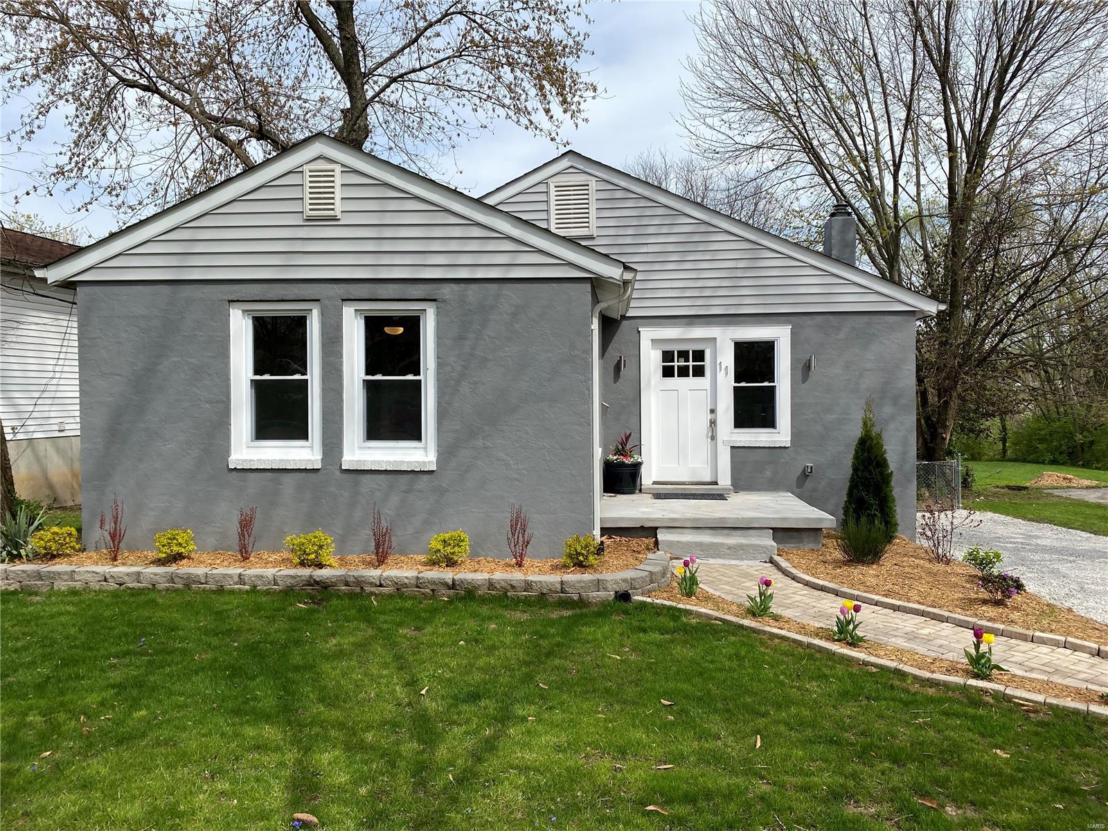 Don't miss out on this 3 bed/2 bath home in Webster Groves, an outstanding school district with A ratings! It is everything you've been waiting for: hardwood floors throughout the first floor, OPEN floor plan, finished WALK OUT BASEMENT, Granite countertops in kitchen and bathrooms, and beautiful finishes. BONUS: An enclosed PORCH looks over the level fenced-in backyard boasting just over 1/3 of an acre!. New Roof, appliances, electrical, plumbing, insulation, drywall, trim, custom cabinets, appliances, and much more! Schedule your showing today! This one won't last long!