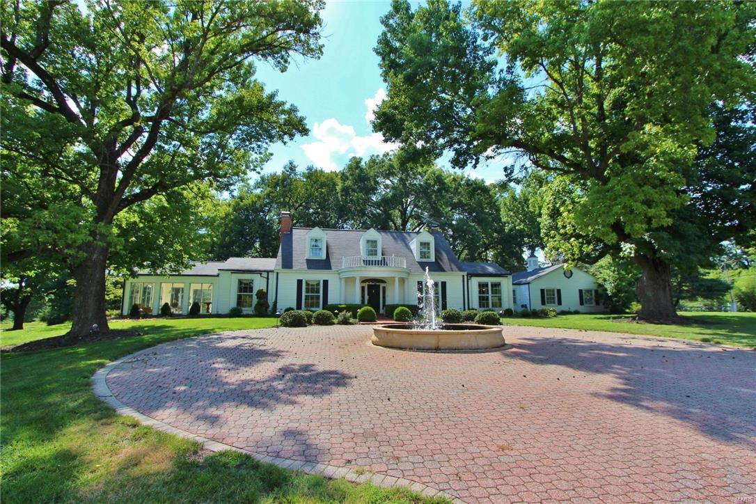 This 2 story, 5 bed/4.5 bath Town & Country home in Parkway School District is the epitome of custom elegance, beginning with curb appeal! A custom designed stone circular drive with classic fountain, well-manicured lawn, lush landscaping and mature trees complement the home. A stunning entry foyer of custom Cherry hardwoods greets you with sweeping staircase. A beautiful hearth room with vaulted ceiling, wood burning fireplace, and built-in cabinetry makes family holidays a dream! A chef's kitchen boasts custom maple 42" cabinetry, 60" Viking Range and Subzero fridge. The 1000 bottle wine cabinet will make you an A+ party host! A 4 season room simply expands your entertainment space. Master suite has double vanity, separate shower, and Jacuzzi tub. This lovely home is not short on storage! A 3 car garage with overhead storage, large storage shed in the backyard, and over a dozen closets, the storage space is more than ample! Additional Rooms: Mud Room