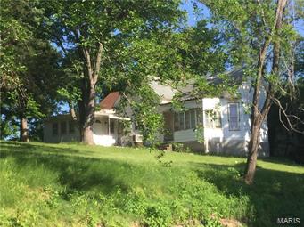 Unique property offers just over two acres in a secluded area.  Older style home suggests many possibilities with nice square footage.