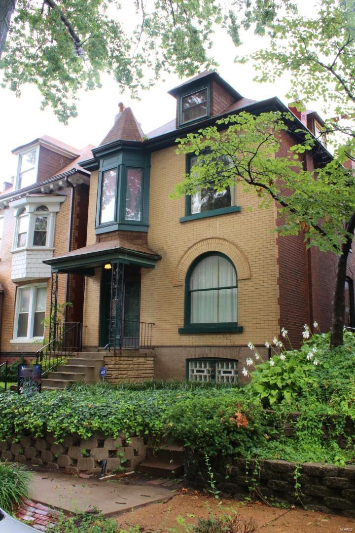 3661 Blaine is a beautiful, architecturally significant home with tons of historic charm. You will love the hardwood floors, stunning staircase, original wood doors and trim, exposed brick, antique lights and built-ins. The first floor entry, dining room and living room have hardwood floors. The kitchen is kitchy cute with a full appliance package and lots of natural light. Enclosed room addition off the back is great for an office, mudroom and lounge. 4 bedrooms upstairs, huge full bath on 2nd floor, powder room on the first and 1/2 bath on the third. Huge walk in laundry room! Back yard is a gardener's dream with a great deck, an arbor for climbing vines and beautiful flower beds. 2 car garage, updated sewer stack, French doors, pocket doors, ceiling fans and other beautiful touches give this home character. Location is excellent being close to South Grand, the hospitals, universities, interstate and downtown. Come check it out!