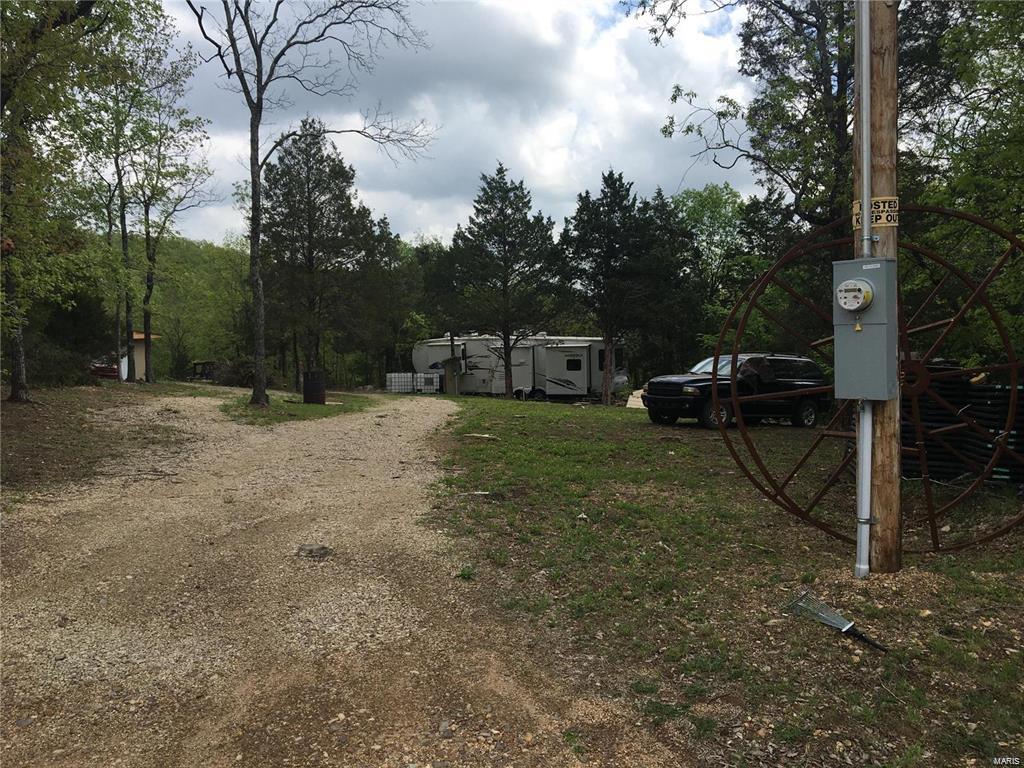 This a very private almost 8 acres.Secluded 7.57 acres with well , septic and Electric. Access to several lakes, Ride your ATV on miles of trails and roads. Close to the Black River , Mark Twain National Forest and State Parks. Mobiles and Tiny Homes are OK. Great place for weekends or year round home. There is a brand new destination trailer on the land that you could by both the land and the trailer for 120,000.00