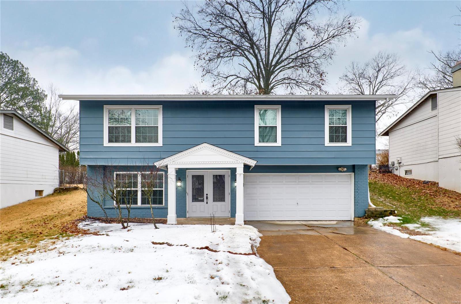 Wow!  Come see this beautiful home!  So many updates, including 42" kitchen cabinets, quartz countertops and stainless appliances.  Remodeled bathrooms, refinished hardwood floors, and fresh paint add to the upscale look.  Completing the package is an amazing level, fenced backyard and patio.  This gorgeous home is move in ready!  Westglen Woods is a sought after community in the award winning Rockwood school district.  Schedule your appointment today.  This home will not last!