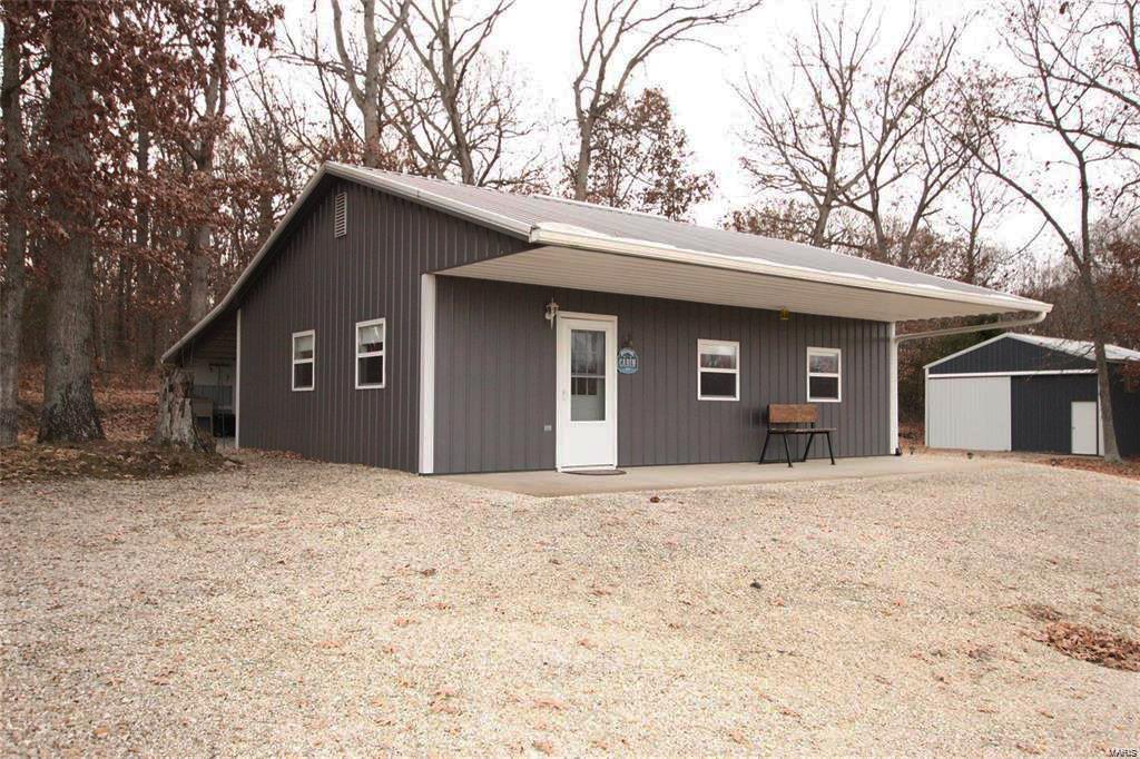 Beautiful income producing 120 acre farm. (Parcel in total is: 220 acre farm in Macon County Approximately 114 acres tillable, 25 acres pasture and 81 wooded acres - Marketable mature timber). Rustic shouse works as a great weekend place or hunting cabin has wood stove for heat and window air conditioner.  Open floor plan with Kitchen setup, it has a county water spigot @ corner of building with a larger covered front porch overlooking most of the property. Adjacent metal barn w/ concrete floor with opposing 12' tall sliding doors for easy equipment storage. Excellent deer, turkey and quail hunting. Stocked pond and Ten Mile creek runs through property for year round water sources.  This is a great mixture use property just call your families name. Tax ID: 000011-0623-00000-00 reflects 220-acre parcel.