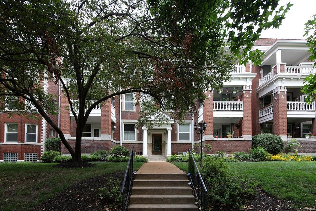 Historic charm combined with modern updates are outstanding in this DeBaliviere Place condo. Pride of ownership abounds & it feels like a house with over 1700 square feet of space! A charming French door from the living room leads to your own porch. Current owner installed stunning wood floors throughout & completed many updates! The kitchen with light wood cabinets, stainless appliances & ceramic tile includes a breakfast area. Sharp granite counters & a stainless range hood were installed to complete the look. Both baths were totally updated with wood vanities, granite counters, cool ceramic tile flooring & tasteful fixtures. The fireplace has a great tumbled stone look & is electric. The large laundry closet has neutral ceramic tile flooring & a stacked washer/dryer. Furnace & A/C were new in July/2015. A secure, gated lot has an assigned parking space a few steps from your back door. AHS home protection plan for the buyer. Close to Forest Park & easy access to anywhere! A must see! Location: Corner Location, End Unit