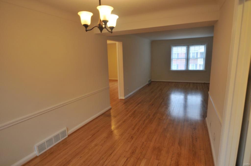 Charming two bedroom and one bath apartment. Second floor unit, hardwood floors throughout. One car small compact garage included. Individual Washer/dryer hook-ups in basement and washer dryer included in the rent.  This is a very attractive and well maintained property. Just blocks from Clayton. Available for a 12 month lease, no dogs/no smoking. Location: Suburban