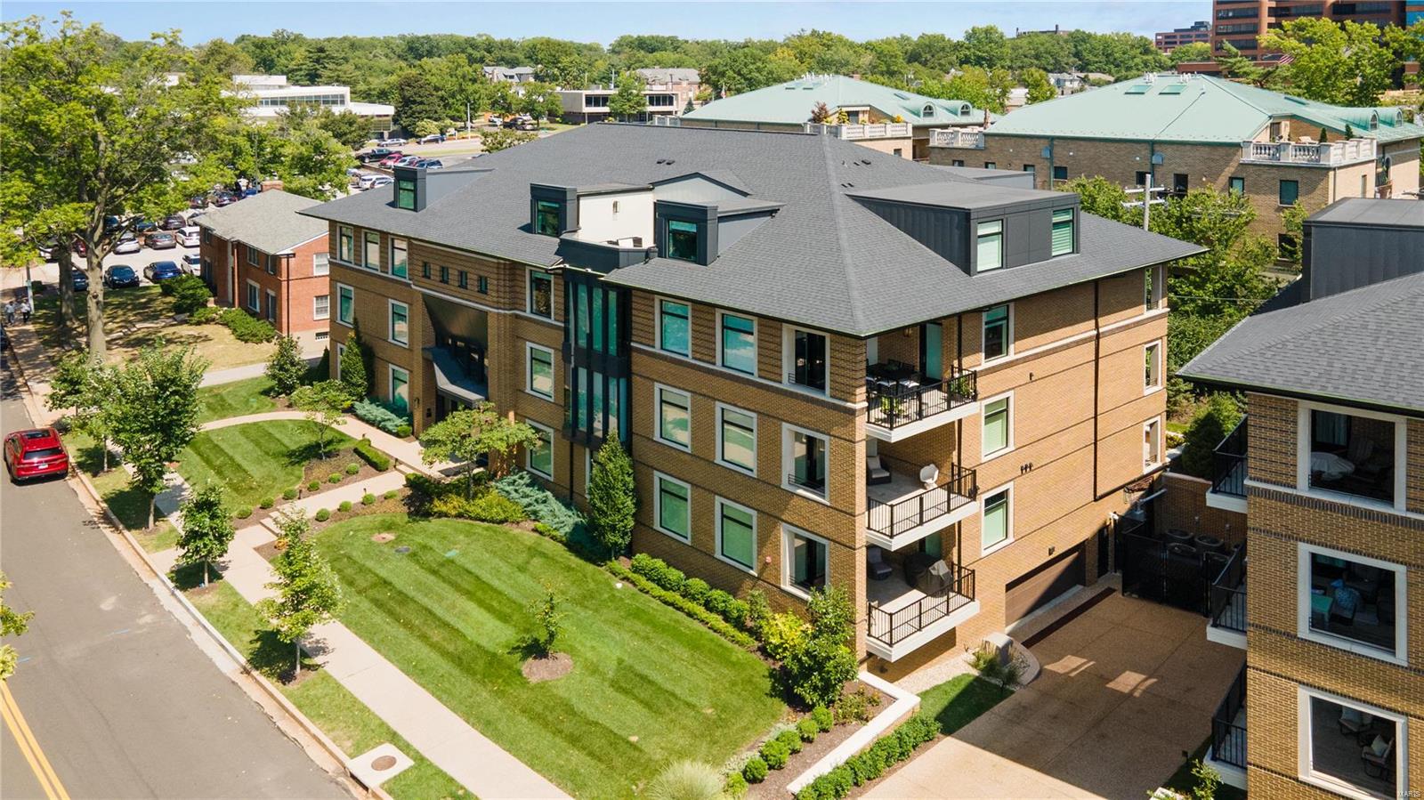 Stunning condo built & designed by Mehlman Homes. Located in the center of Clayton & walking distance to restaurants, shops & Shaw Park. Features 3,078 sq ft with a main floor Primary suite, 2 upper bedrooms (1 is a suite) & 2 baths. Main floor private office has expandable door by Raydoor & custom glass wall separating staircase. 1st floor large foyer, main floor laundry, light filled rooms with Hunter Douglas remote shades. Upper floor includes a bar, refrigerator, ice maker & family room that leads to a beautiful spacious deck, perfect for entertaining. Luxurious designer kitchen with quartz counter tops, custom porcelain tile backsplash, Wolf appliances, Sub Zero refrigerator & oversized island. You will love the flow between the kitchen & living room with dramatic 10 ft. high ceilings, 7.25 inch baseboards & crown molding. Custom closets designed & installed by The Closet Factory. Garage includes 2 parking spaces, storage room & optional charging station. Luxury living in Clayton! Location: Upper Level