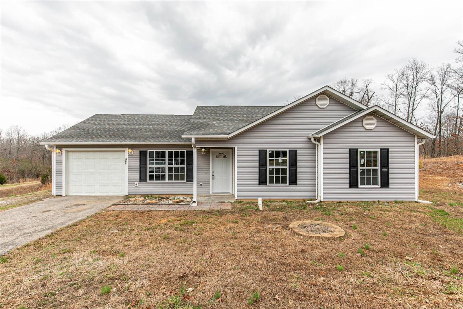 Located in North Poplar Bluff, 2010 Construction, and will pass any loan criteria required! This 3 bedroom 2 bath home is sure to impress, offering modern colors and finishes throughout, vaulted ceiling, custom kitchen w/ Stainless appliances, central heat and air, a master suite with bluetooth speaker/fan combo in the master bath, ample yard space with partial fencing, garage, and so much more. Priced below $125,000!
