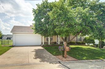 This attractive ranch has great curb appeal! Upon entry into the home you will notice the open floor plan featuring vaulted ceilings in the living room.  The kitchen and dining area also feature the vaulted ceilings.  Gleaming hardwood floors also adorn this space. The living room also features a beautiful fireplace for those cold winter evenings. The master bedroom features a walk-in closet and private bath with skylight. Each of the bedrooms features neutral carpet and paint ready for your furnishings! Ceiling fans also adorn each bedroom.  This spacious backyard is also perfect for the home entertainer. Great location with easy access to Hwy 94, Page Extension & Hwy 70. Schedule your private showing today because this one won't last long!