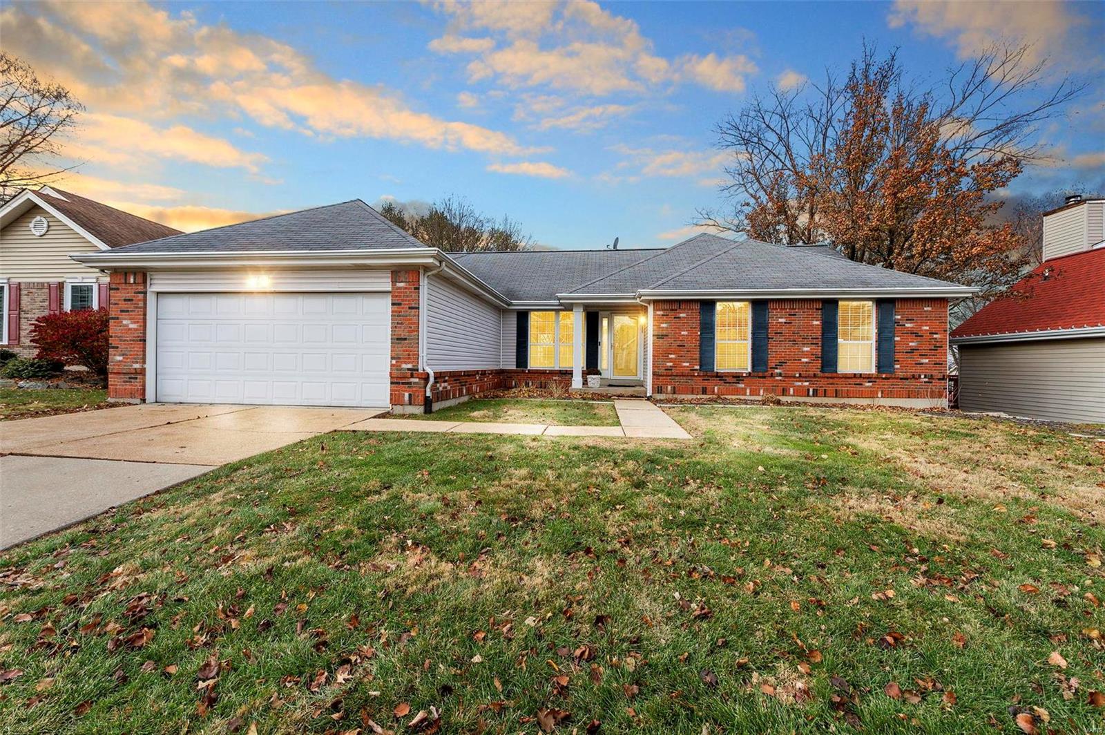 BACK ON MARKET - NO FAULT OF SELLER. This lovely home offers over 1,600 sq ft of living space, with three bedrooms and two bathrooms on the main level, plus a spacious sleeping room and bath in the finished walk-out lower level. You'll find high ceilings and lots of natural light from big windows and skylights. The floors are a mix of carpet, laminate, and vinyl, with stylish chandeliers and recessed lighting. The well-appointed kitchen features a spacious island and breakfast room that opens to a covered deck. You can relax by the fireplace in the living/dining room combo or retire to the primary suite with its own bathroom featuring a tub and shower. Outside, enjoy a fenced backyard, covered deck, and patio—great for hanging out or hosting friends. A 2-car garage conveniently opens into the main level laundry/mud room. This home is a perfect blend of comfort and style, just waiting for its new owners. Don't miss out on making 1125 Dunston Drive your new home!