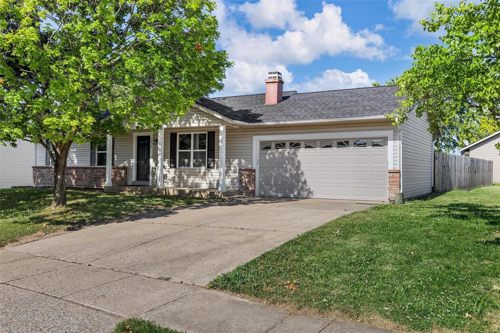 Come see this AMAZING move-in ready, 3 bed 2 full bath Ranch home in O'Fallon! You'll walk into a lovely open layout, great for entertaining. The living room features a woodburning brick fireplace and flows into the spacious eat-in kitchen with stainless steel appliances, granite countertops and white bright cabinets. The master bedroom has a master bathroom with a nice walk-in shower. Two more bedrooms and another full bath complete the main floor. The partially finished lower level adds to your living space with a large family/rec room, sleeping area/office and workout room, as well as plenty of space for storage and a rough-in for an additional bathroom. Additional Features: Newer vinyl plank flooring, carpeting and light fixtures throughout. HVAC (2022), Architectural Roof (2022). Large corner lot w/ partially fenced back yard & patio. Just a short distance from schools, highways, shopping & restaurants.