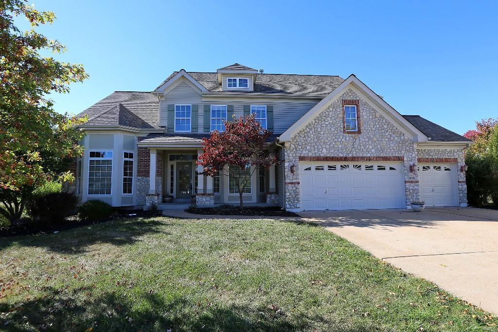 Pride of ownership is reflected in this beautiful custom 1.5 sty w/6 bedrms, 5 baths & a finished w/o lower level. The enormous open floor plan features more than 4500 sq. ft. of living space. 2 sty entry foyer flanked by beautiful arched doorways leading to the living room & dining room. The light-filled great room has a 2sty wall of windows overlooking the huge low maintenance deck & well groomed yard. Gourmet kitchen offers custom cherry & maple cabinets, butler’s pantry & adjoining hearth room w/2nd fireplace. Main floor laundry & quaint powder room conveniently located nearby. Main floor master features a large sitting room, walk-in closet & luxury bath w/dual sinks & garden tub. The 2nd level boast a family room, an en suite plus 2 additional bedrms w/Jack-n-Jill bath. The finished w/o lower level is the place to be-huge rec room complete w/wet bar, & 2 additional bdrms & full bath. New roof & gutters (2015). This home has wonderful curb appeal & located in a quiet cul-de-sac.