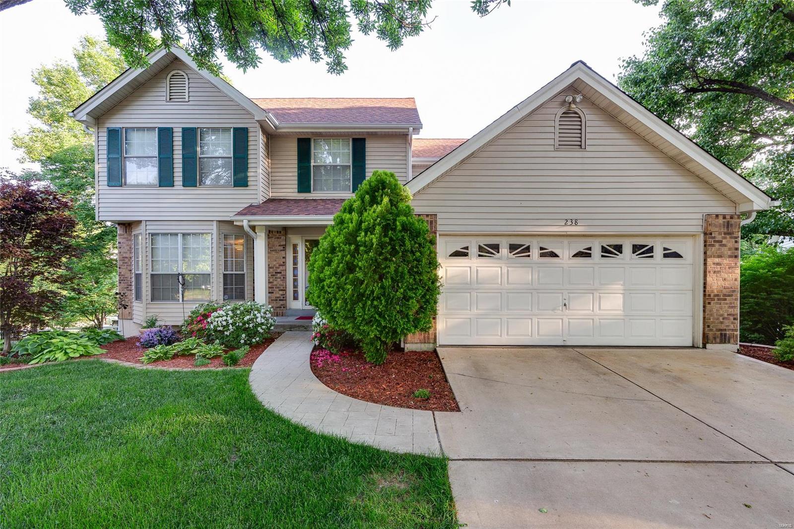 This home is stunning & offers all of today’s desired features. Former best in class display, located in a sought-after neighborhood & location. Custom Kitchen, 42” cabinets, granite counter-tops, double 36” ovens–a baker’s dream, nice pantry, breakfast room that opens into a comfortable family room - beautiful fireplace & lots of windows.  The home also features a formal dining room with den/living/office – you chose.  The master suite includes vaulted ceiling w/fireplace too.  Extra’s include hardwood floors, new carpet, 5 bay windows, 2 fireplaces, solid core 6-panel doors & crown molding too.  New architectural roof, gutters, sky light in 2015, fabulous 24x10 maintenance free Treck Deck, partially finished walk-out basement, beautiful fenced yard with professional landscaping that's just beautiful in any season & irrigation system. Situated in cul-de-sac w/great neighbors, close to schools, parks & minutes to shopping! This home is beautiful and you must is it to appreciate!