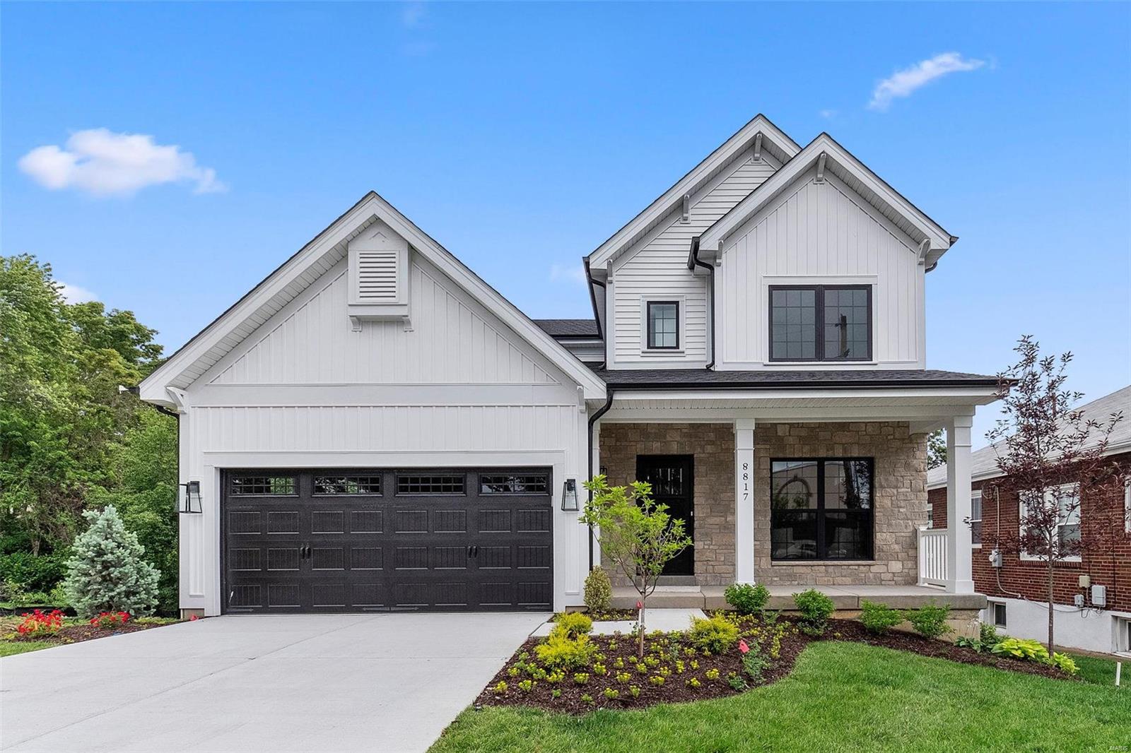 New custom modern farmhouse home just completed in Brentwood.  This 5 bedroom, 3.5 bath home features 9' first floor ceilings, built-in bookcases on each side of gas fireplace in family room with shiplap above, timber mantel, feature wall in den.office, hardwood flooring all of 1st floor and 2nd floor hall, full overlay custom kitchen cabinets with soft close solid wood drawers, crown molding, stainless steel appliances, Quartz countertops with waterfall island top and apron sink, coffered ceiling in master bedroom, luxurious master bath with double sinks, stand alone tub and shower, and walk-in closets, Quartz countertops in all baths, custom millwork with 3-panel doors with 3 1/4 inch casing and 5 1/4 inch base molding.  Custom staircase with wood treads.  Walkout basement with finished lower level with rec room, full bath, vinyl plank flooring, and bedroom.  Beautiful deck with stairs. Fully sodded yard, sprinkler system, 1 year builder warranty.  A new home will be built next door.